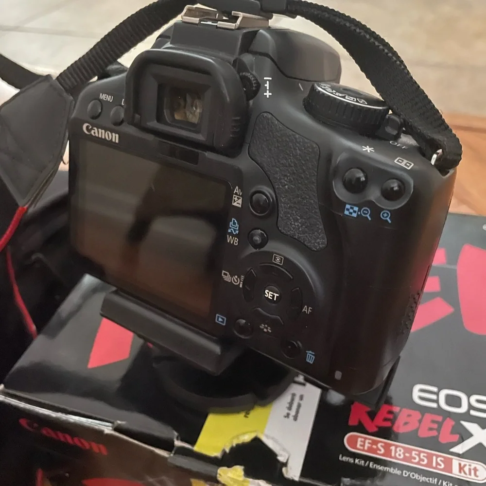 Canon Rebel Xsi DSLR camera with EF-S 18-55mm lens.